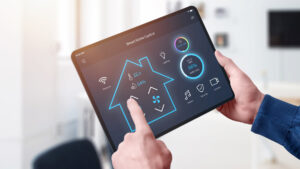 All in one smart home control system app concept on tablet display in man hands